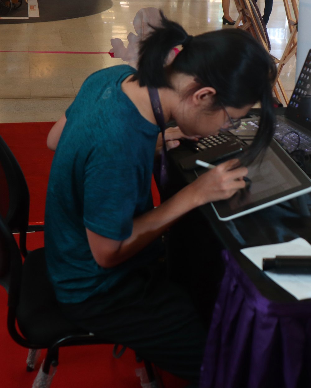 MCTC student drawing on a tablet